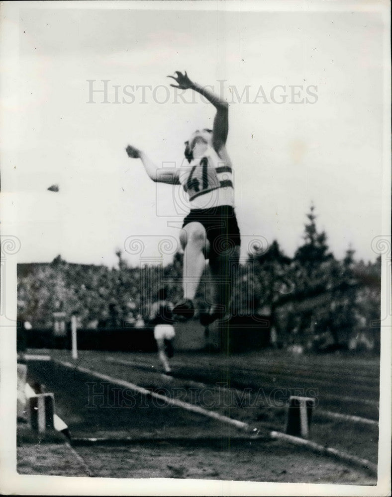 1955 British Girls Take First And Second Places in Long Jump Event - Historic Images