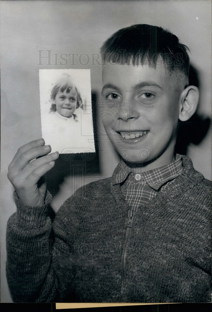 1959 Boy and picture of sister who was in coma for years - Historic Images