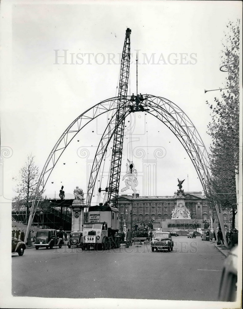 1953, Coronation Preparation,cranes hoist unicorn unto arch - Historic Images
