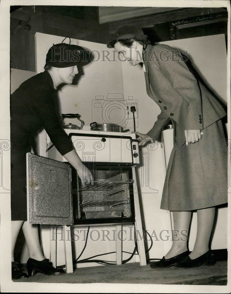 1953 Mrs. Scallan,  Miss E. Lasson Anderson & new kitchen appliance - Historic Images