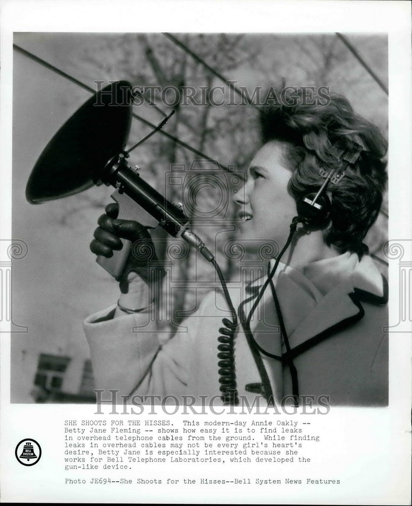 Press Photo Betty Jane Fleming uses instrument for overhead telephone cables - Historic Images