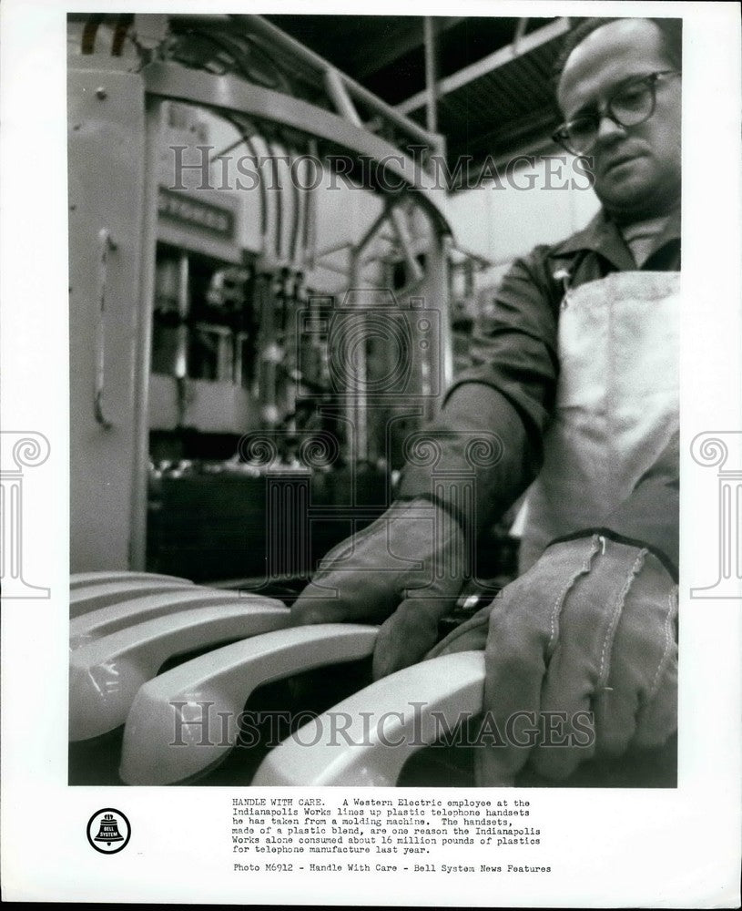 Press Photo Western Electric employee & handsets - KSB35417-Historic Images