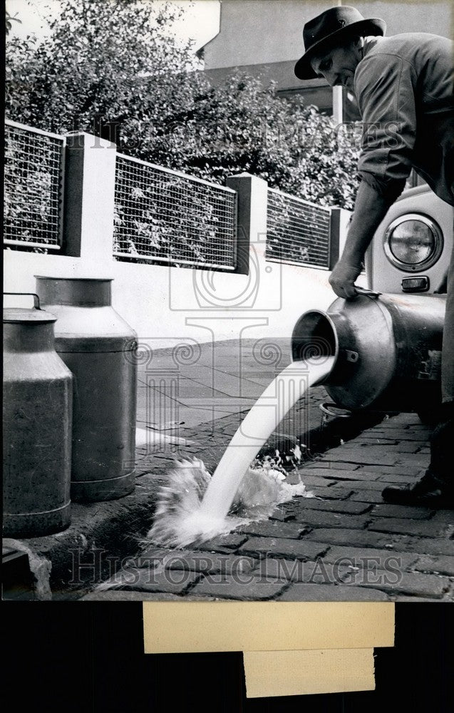 1955 Press Photo Milk Is More Expensive So Vendors It Must Throw Away In Germany-Historic Images