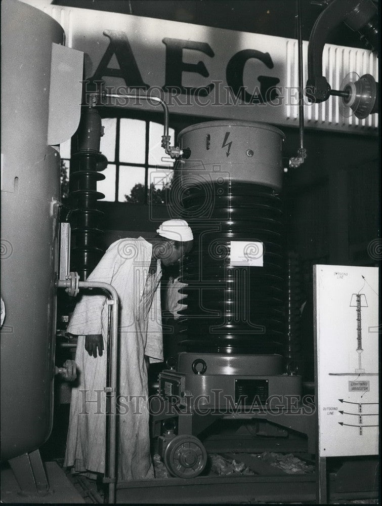 1957 Arab Citizen Looks At Large Transformer German Industrial - Historic Images