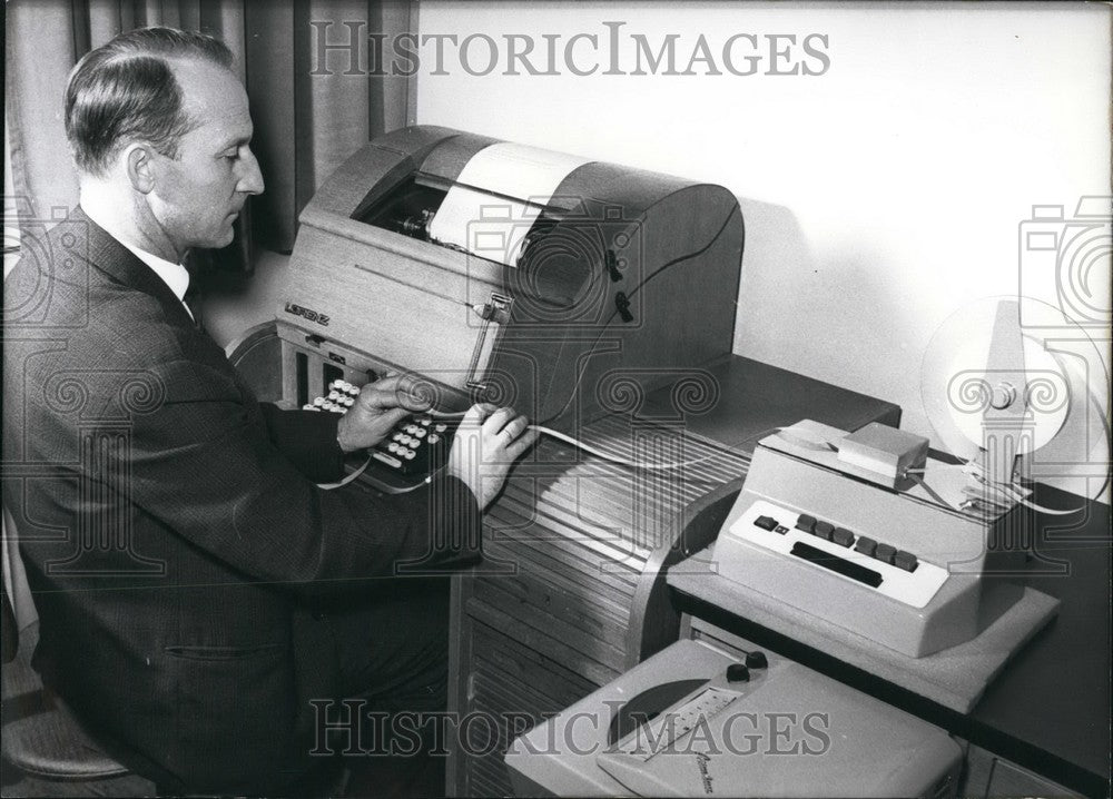 1965 Oberpostinspektor Thiel testing a blind telegraphic recorder. - Historic Images