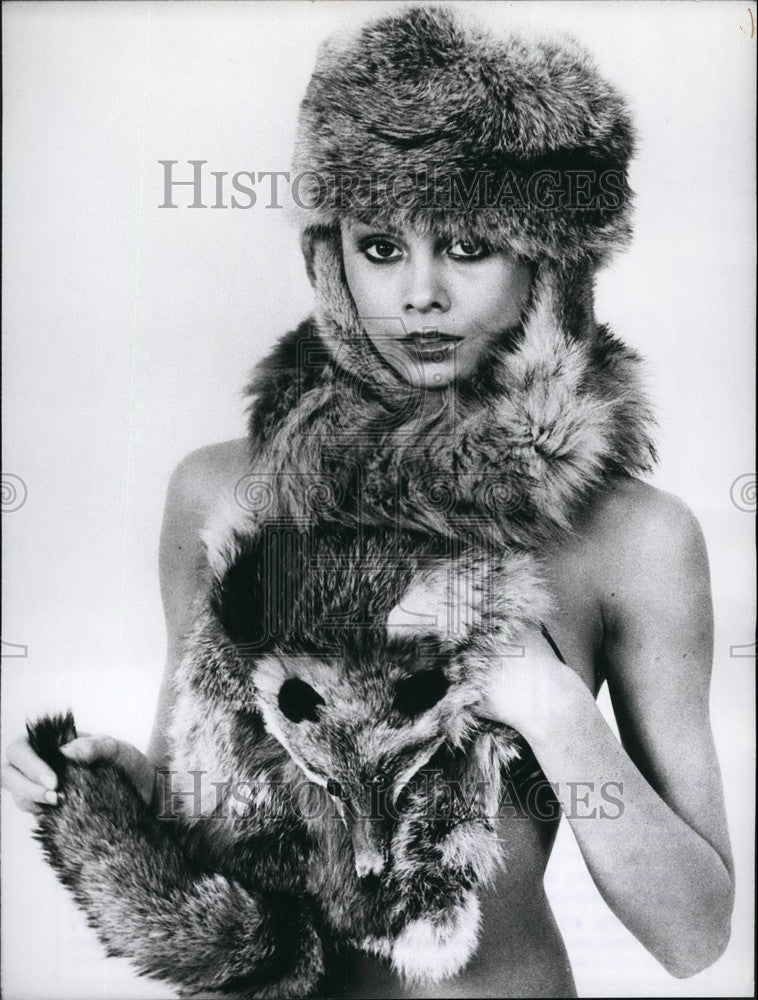 Press Photo Wears Cap and Muff with Head & Eyes of Fox - KSB47519 - Historic Images