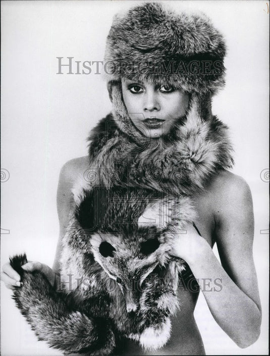 Press Photo Wears Cap and Muff with Head & Eyes of Fox - KSB47519 - Historic Images