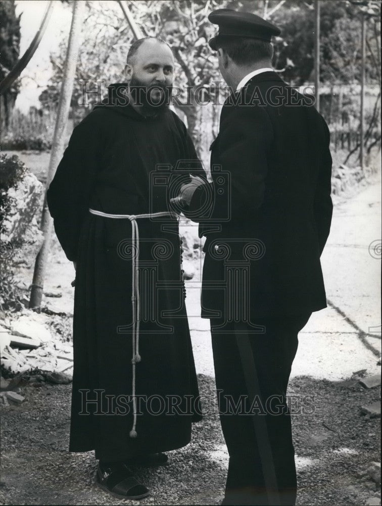 1965 A friar and an Italian policeman  - Historic Images