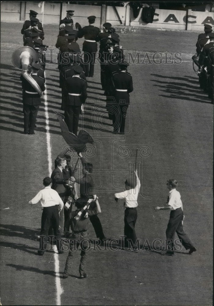1959 Welsh supporters & French Police band at soccer match - Historic Images