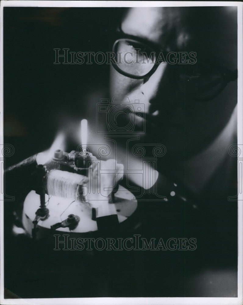 1969  Dr. Craig S. Tedmon, Jr., & Small electric motor runs red hot - Historic Images