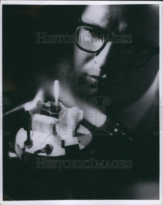 1969  Dr. Craig S. Tedmon, Jr., & Small electric motor runs red hot - Historic Images