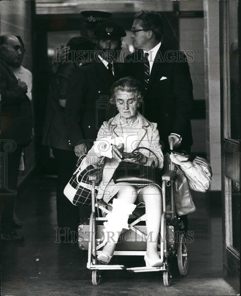 1973 woman wheelchair bomb explosion Euston Station concourse injury - Historic Images