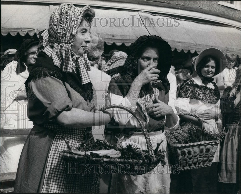 Press Photo Locals In Costume Enjoy Drinks While Watching Events - KSB57089 - Historic Images