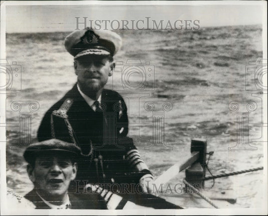 1957, The Duke Of Edinburgh takes the tiller of the long boar Lorna" - Historic Images