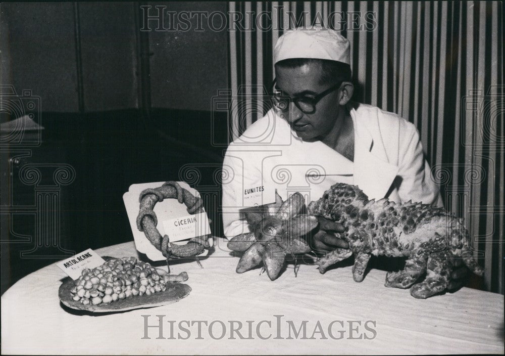 1956 Paris Baker Exhibits Ancient Greek and Egyptian Bread: - Historic Images