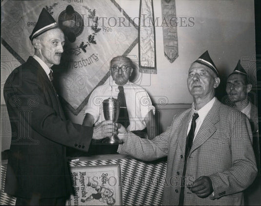 Press Photo The chairman of the winning club "Unity", just gets the cup - Historic Images
