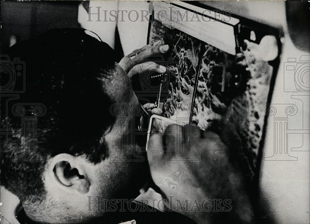 1968 Aerial Engineer Examines Aerial Photos Of Area Plane Maybe Lost - Historic Images