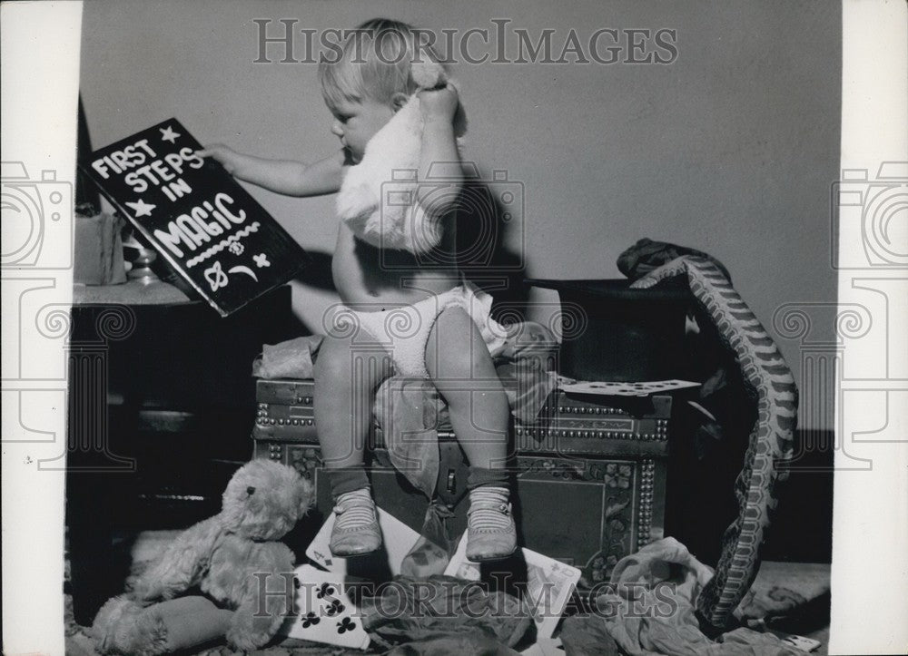 Press Photo Sheron carefully follows the instructions as set down in the Book of - Historic Images