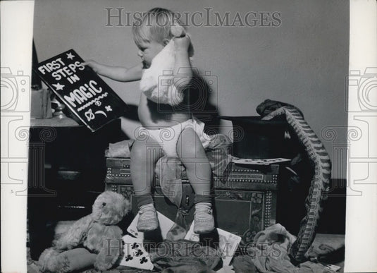 Press Photo Sheron carefully follows the instructions as set down in the Book of - Historic Images