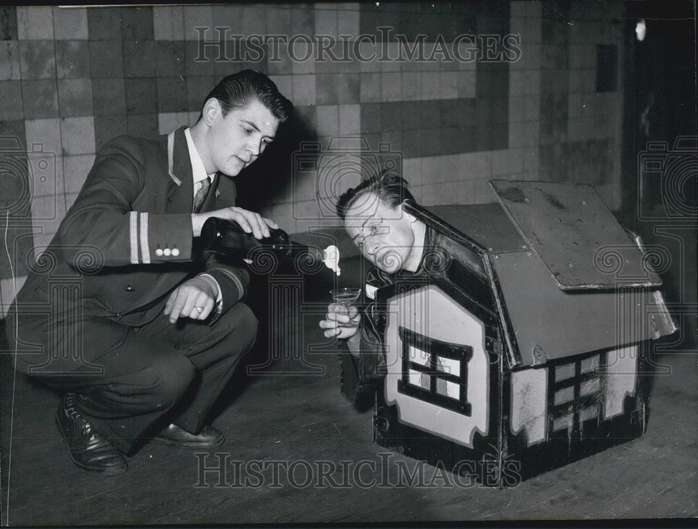 1957, Chester Tooko in a tiny house - KSB64641 - Historic Images