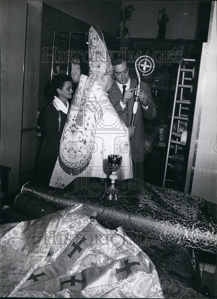 Press Photo A Bishop Tries On His New Cope And Mitre And Inspects His Crook - Historic Images