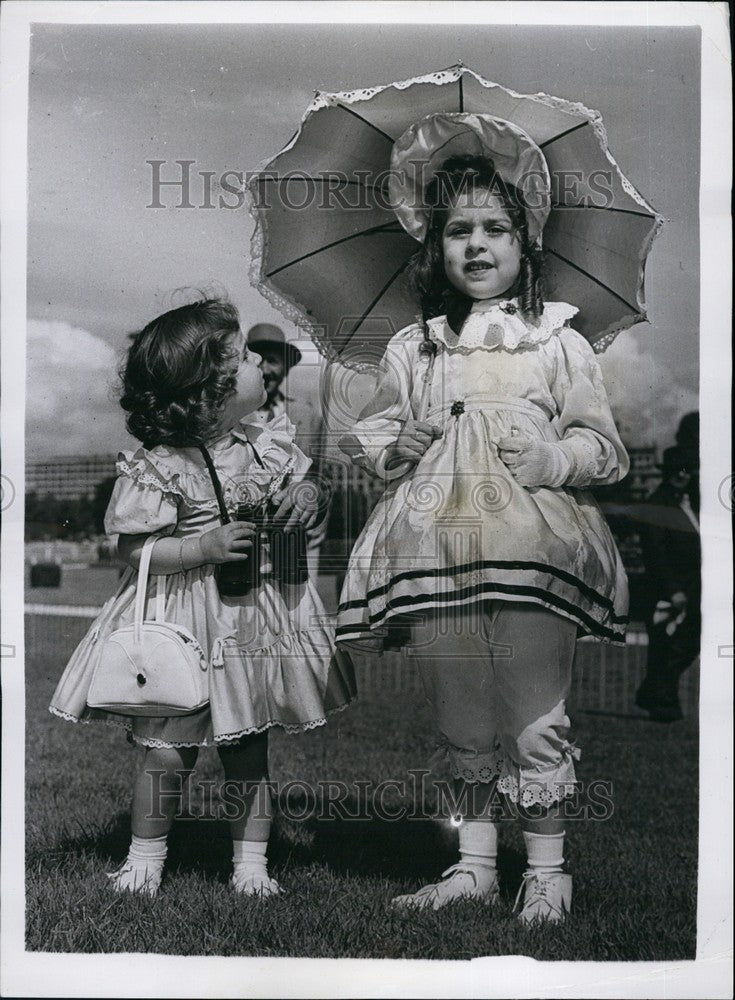 1958, Two youthful mannequins wearing contrasting outfits in France - Historic Images