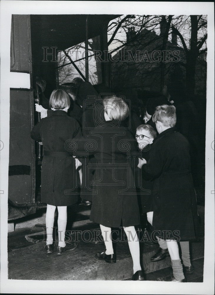 Press Photo Children Pour Onto Bus at School Playground - KSB67593 - Historic Images