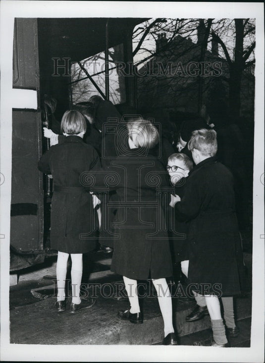 Press Photo Children Pour Onto Bus at School Playground - KSB67593 - Historic Images