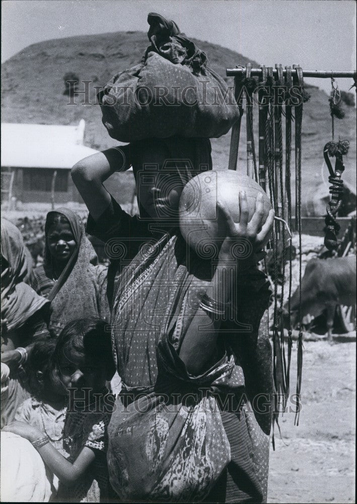 Indian market,young vendor of melons  - Historic Images