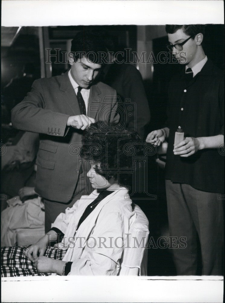 Two of his junior assistants at work.  - Historic Images