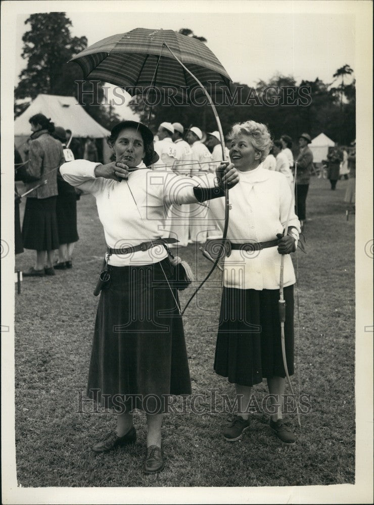 1956 International Archery Tournament.Practicing in the rain - Historic Images