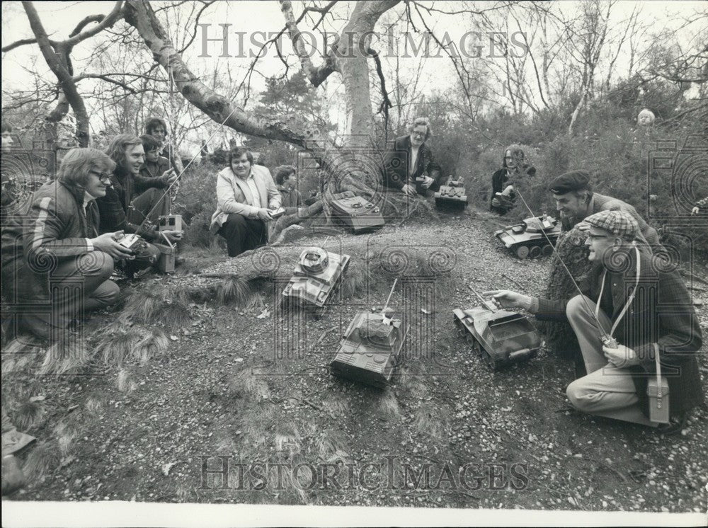 Press Photo Group members and fans and toy tanks - Historic Images