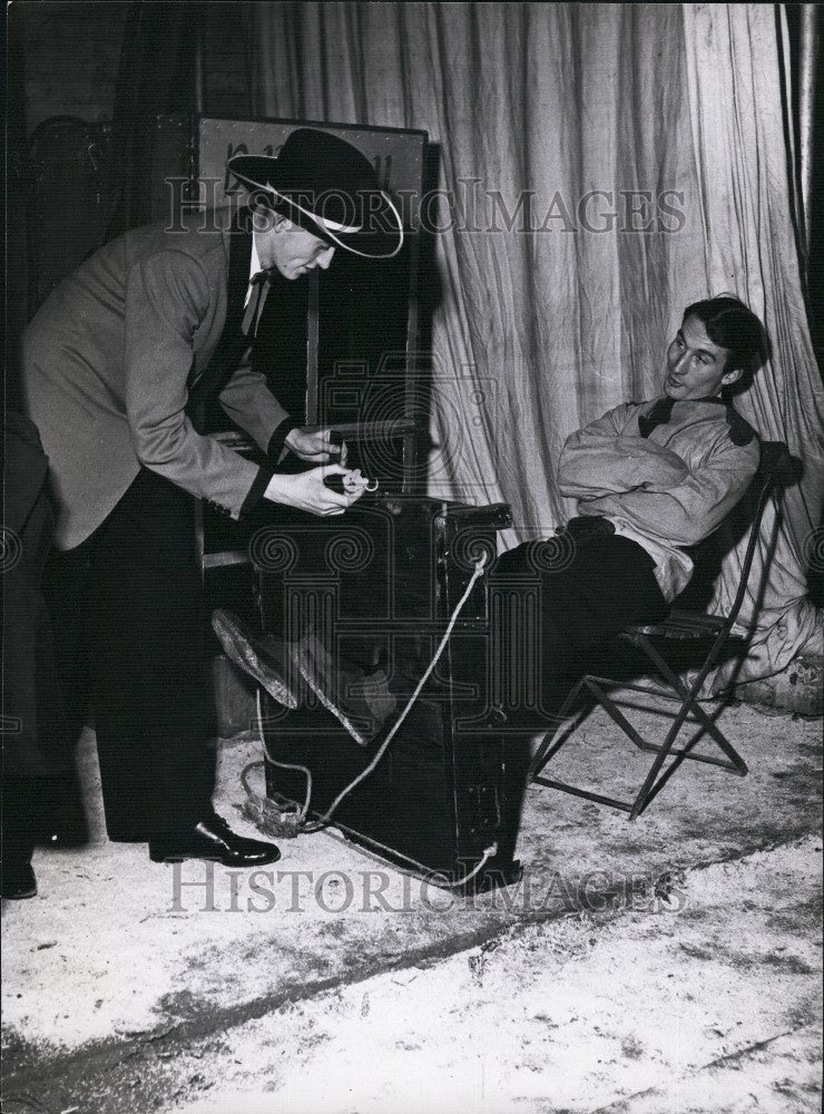 Press Photo Timothy is Next Locked into a Pair of Stocks & Strait-Jacket - Historic Images