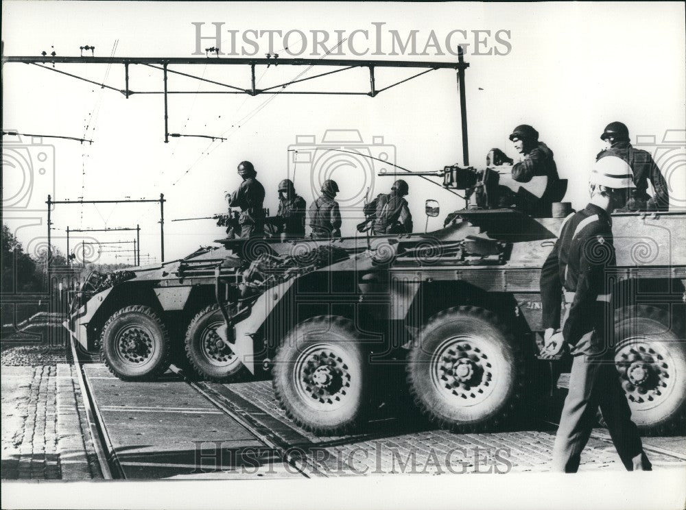 1977 Armed cars guarding occupied train near Groningen, Holland - Historic Images