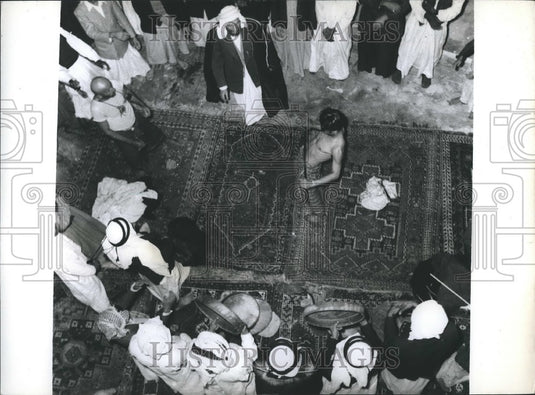 Press Photo Under Allah's Protection: Arab Tries to slice his belly with sword - Historic Images