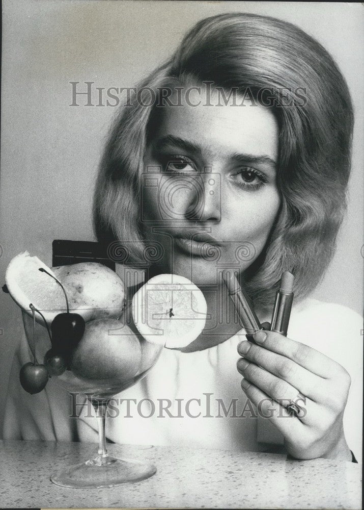 1965 Press Photo Woman showing off flavored-lipstick. - KSK02041 - Historic Images