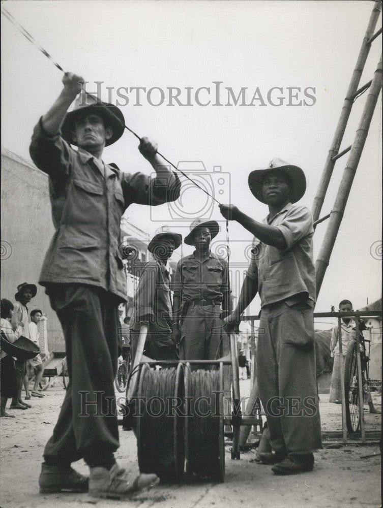 Press Photo Workers Clean Up Port Phan Thiet Power Lines - KSK02925 - Historic Images