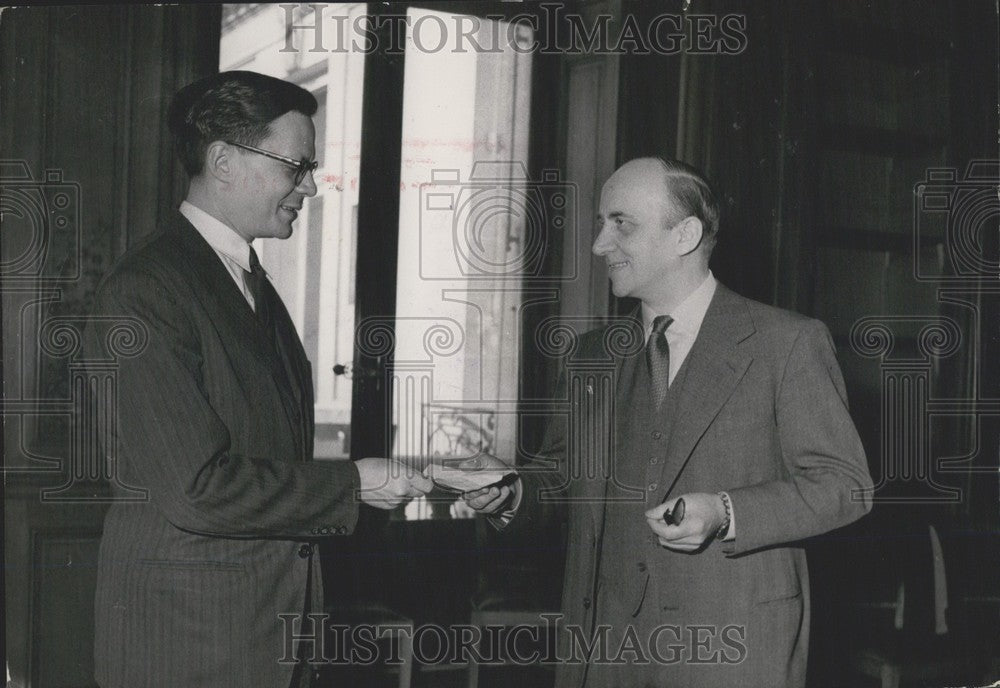 Press Photo Robert R. Marjolin Passes Out Checks to Help Europe&#39;s Flood Victims - Historic Images