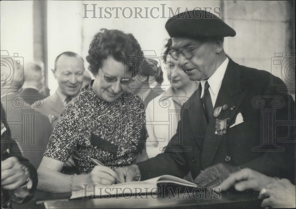 1958 Wife of General Massu Signing the Golden Book - Historic Images