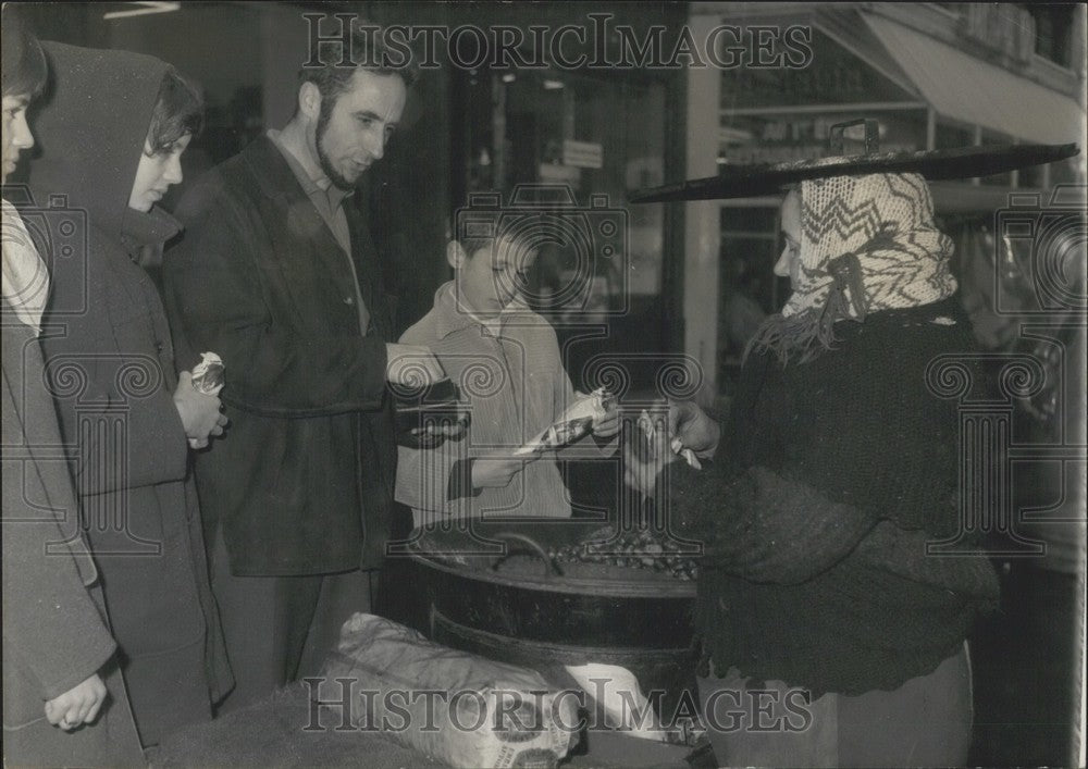 1962, Selling Hot Chestnuts on the Sidewalk - Historic Images