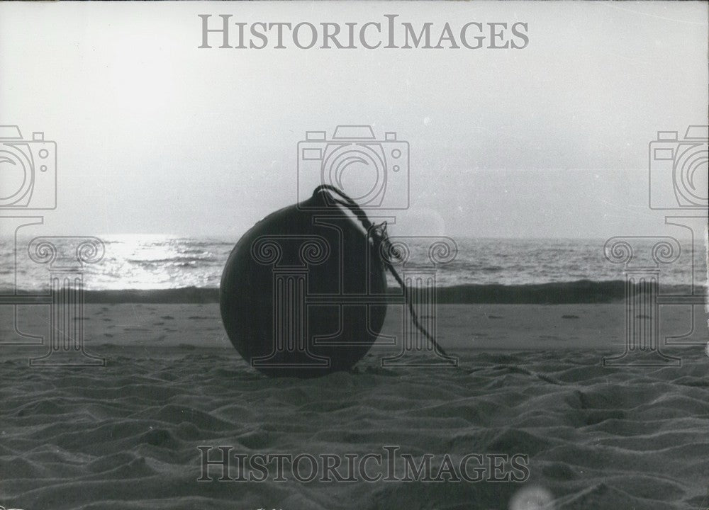 1968, Buoy Tethered to Beach - Germany. - Historic Images