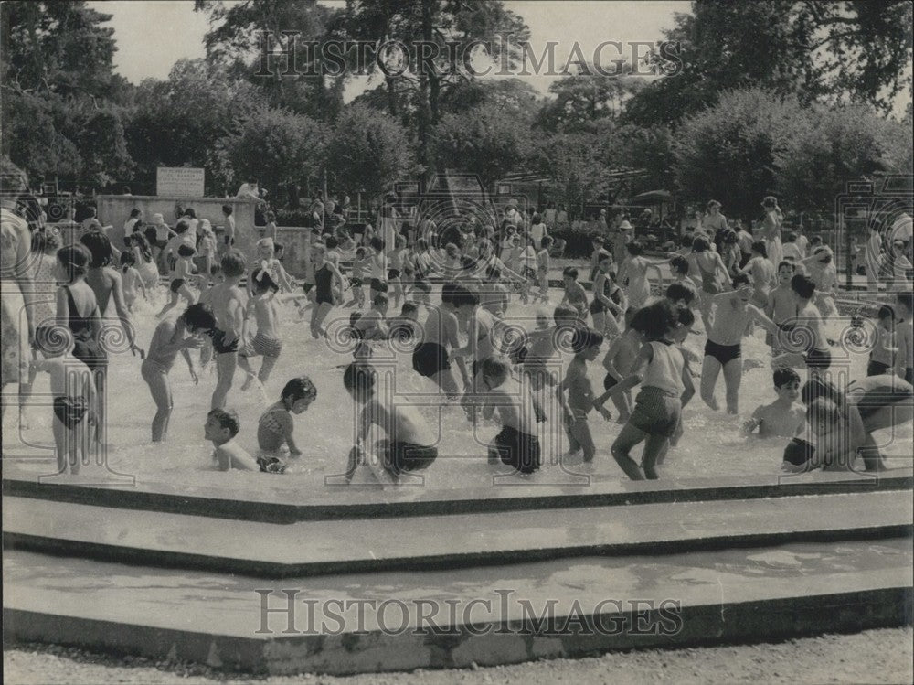 1966, Children &amp; Adults Cool Off in Paris Pool on Hottest Spring Day - Historic Images