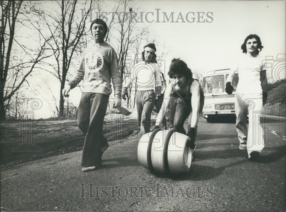 1981, Young Men Rolling a Barrel of Beer in a Contest - Historic Images