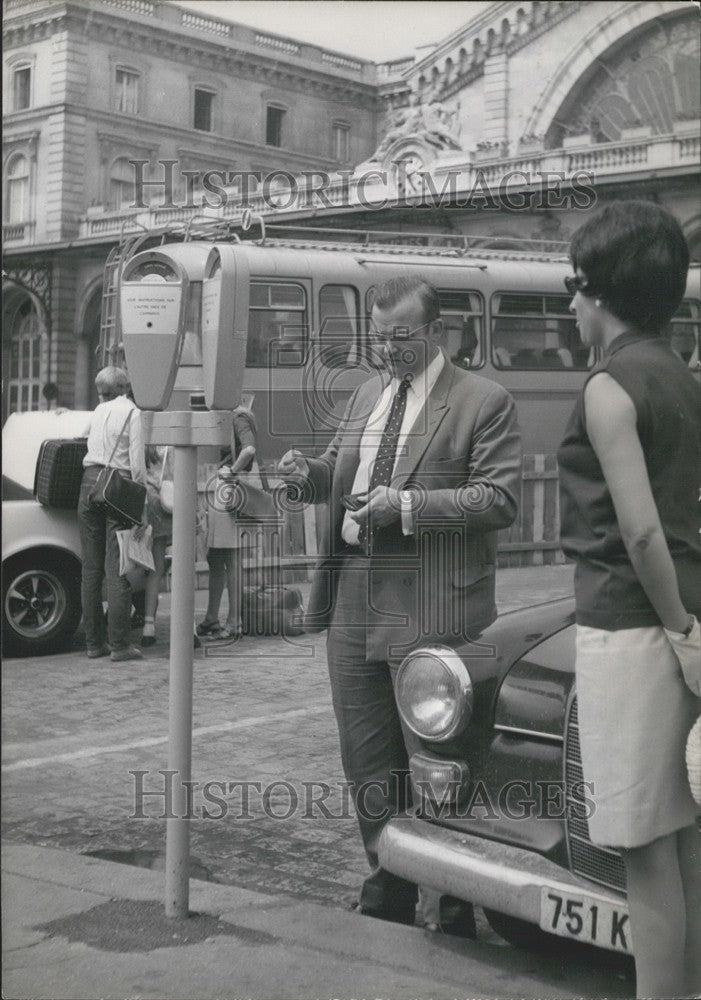 1969, Man Paying the Parking Meter at Paris's East Train Station - Historic Images