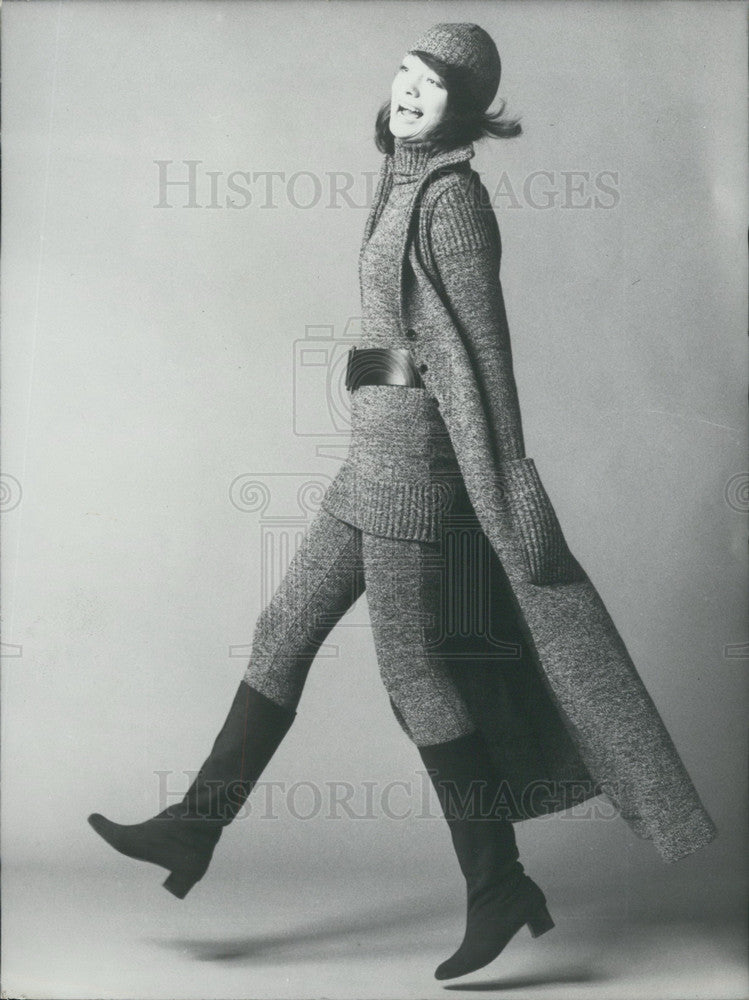 1970 Press Photo Model in Winter Maxi Coat, Leggings, Turtleneck Sweater, & Cap - Historic Images