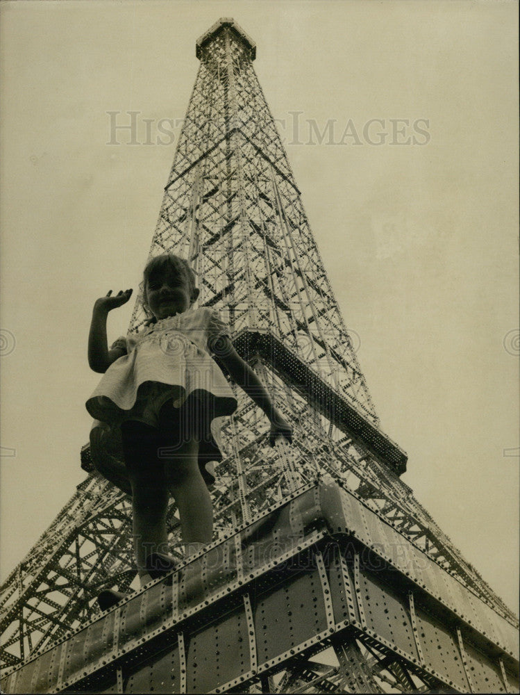 1965 Little Nadine Thiebault with Mini-Eiffel Tower in Paris Garden - Historic Images