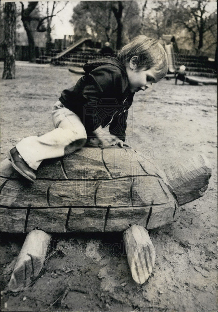 1978 Press Photo Child Playing on a Wooden Turtle in a Park in Budapest - Historic Images