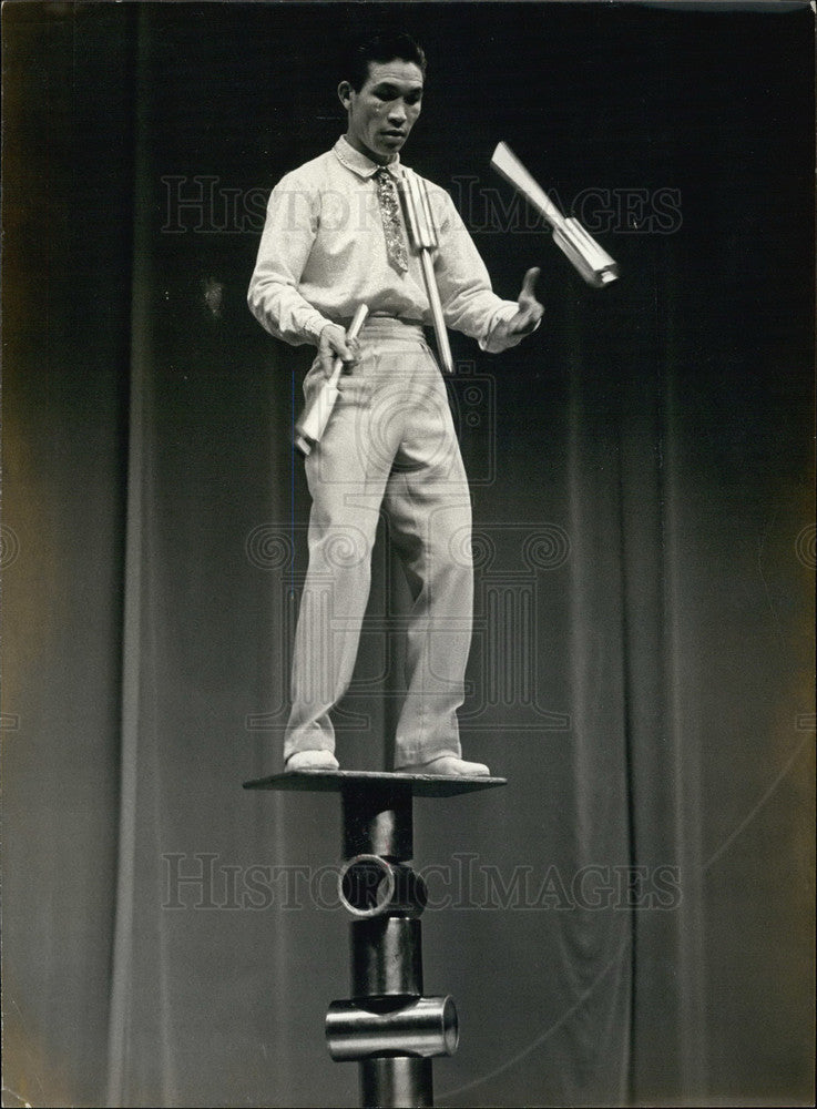 1977 Sin Tcheul Gyoun Juggles on Cylinders at Palais des Sports - Historic Images
