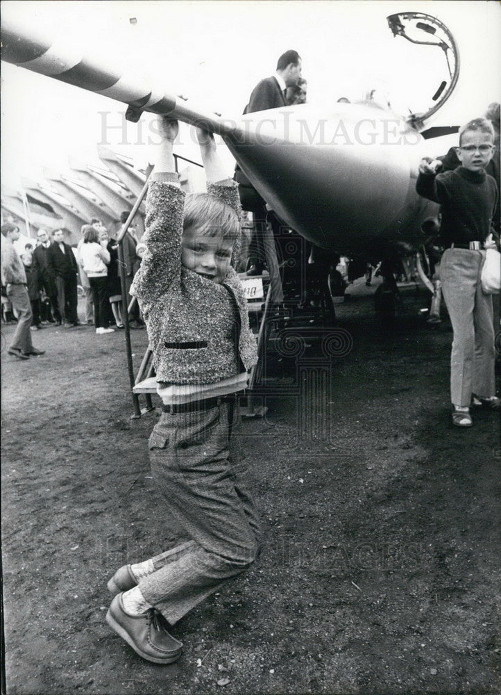 1967, Boy Hanging on Plane Nose at German Air Force Exhibition Bremen - Historic Images