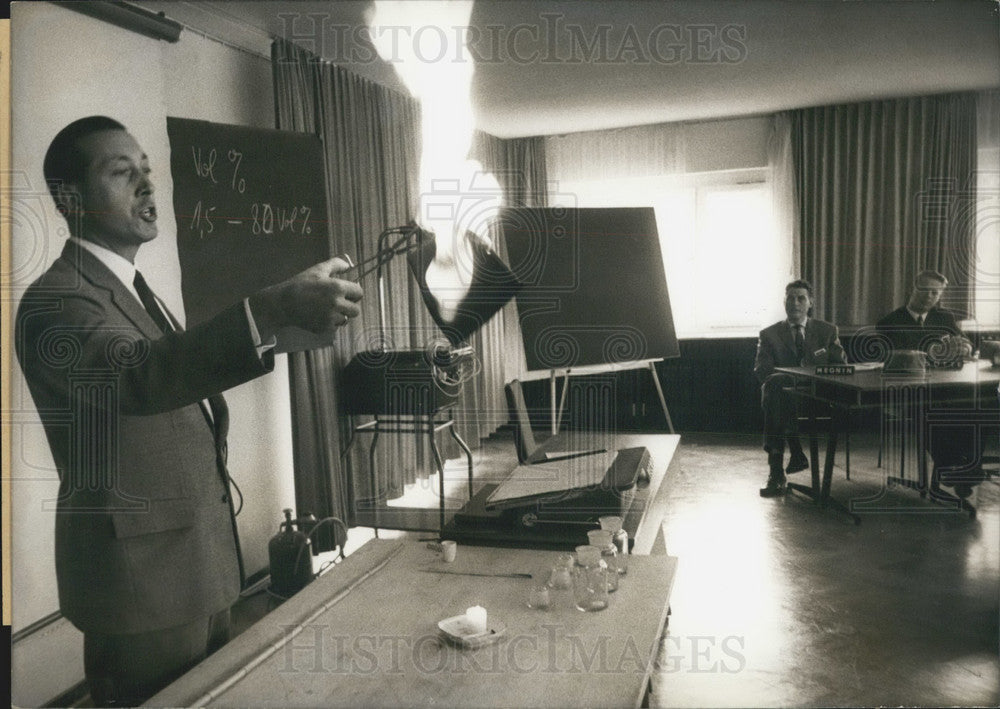 1967 Press Photo Lecturer Sets Fire to Object, Fire & Accident Training. Germany - Historic Images